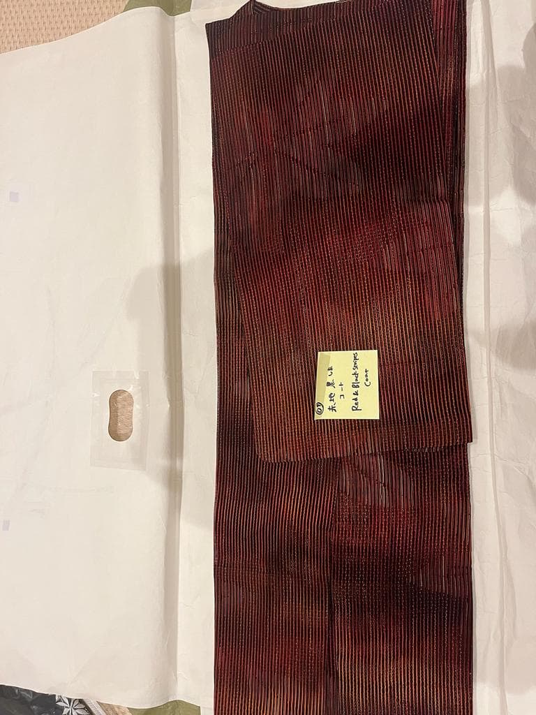 Full view of red and black striped coat.